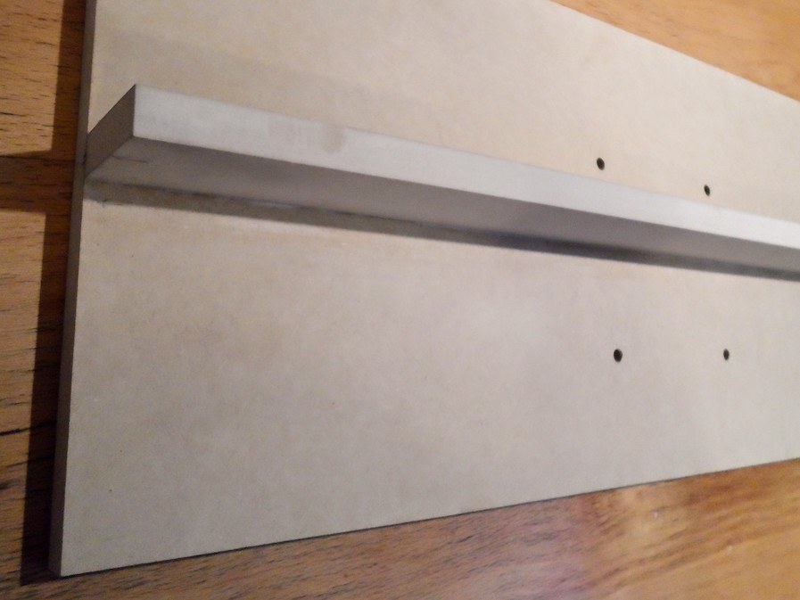 A board with a little strip glued behind, forming a T