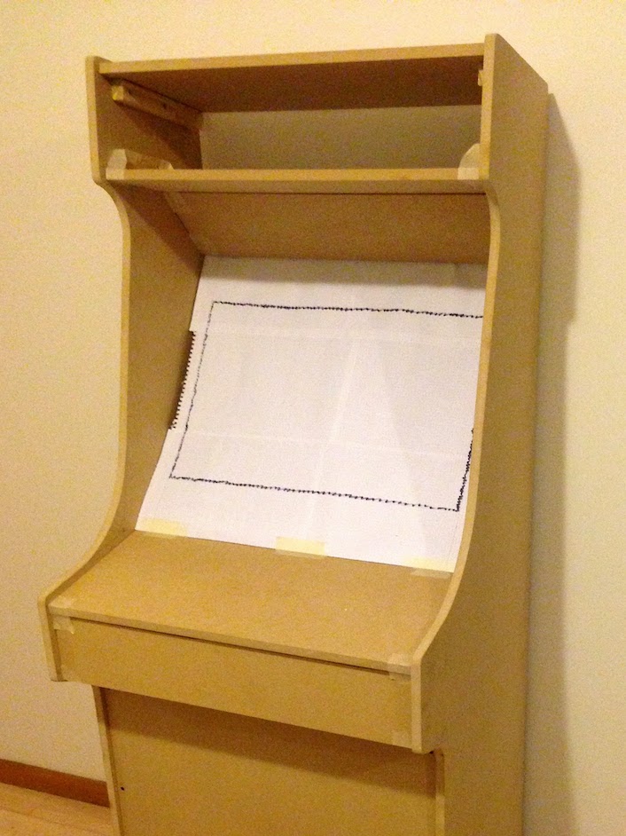 A sketch of a monitor made out of paper, installed on the wooden cabinet