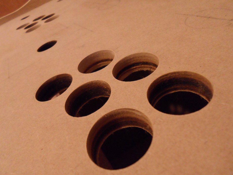 A closeup of holes in the wood