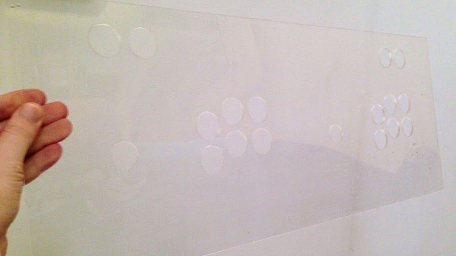 An acrylic sheet with 18 holes