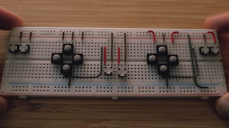 Breadboard with tactile buttons and ground connections wired