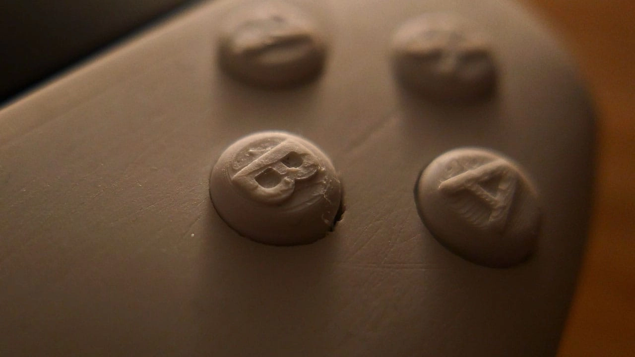 Close-up view of the B and A buttons