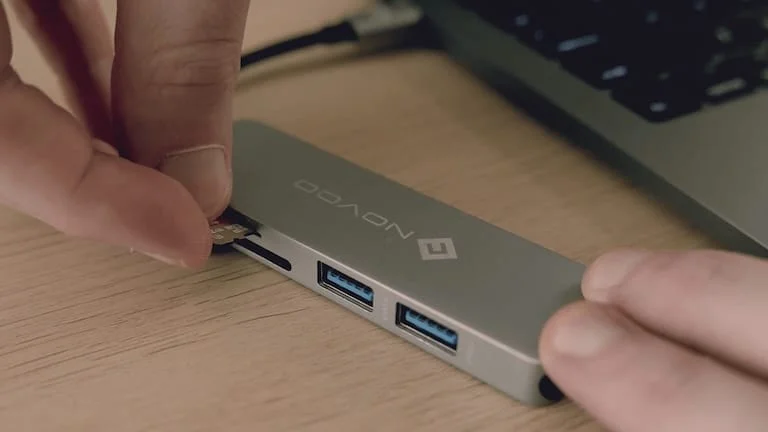 Inserting a compatible SD card into a computer