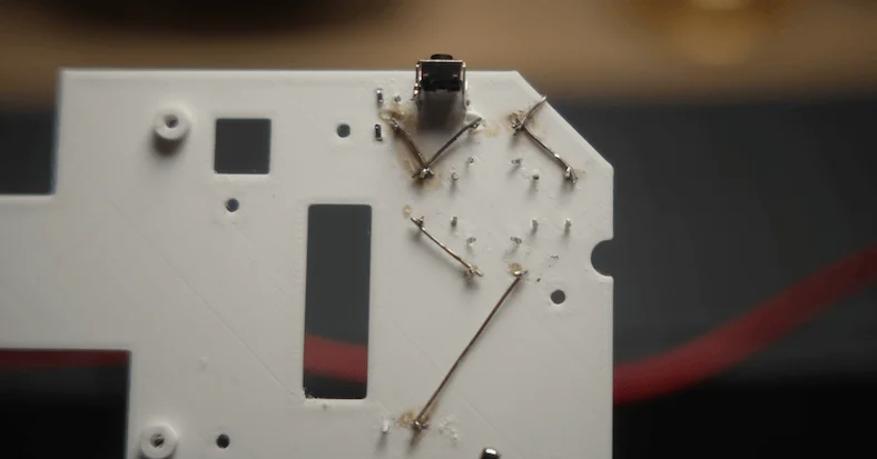 Ground legs of the buttons soldered together in series