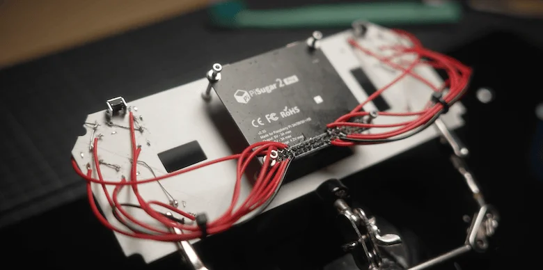 Positive legs of the buttons soldered to wires