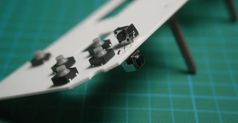 Fake PCB frame with tactile push buttons inserted